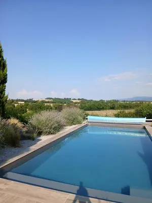 a swimming pool in a villa with a view at Les Treillettes in Puylaurens