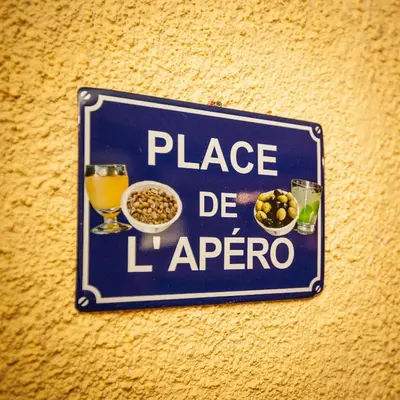 a sign hanging on a wall with food and drinks at Chateau de Camurac in Camurac