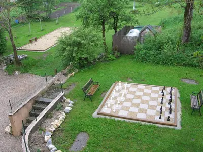 a chess board in the middle of a yard at Chateau de Camurac in Camurac