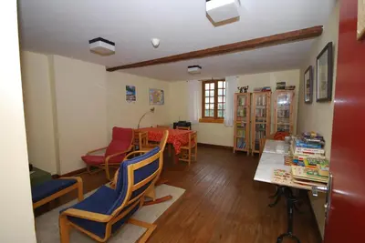 a living room with a table and chairs at Chateau de Camurac in Camurac