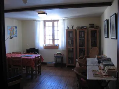 a dining room with a table and chairs and a window at Chateau de Camurac in Camurac