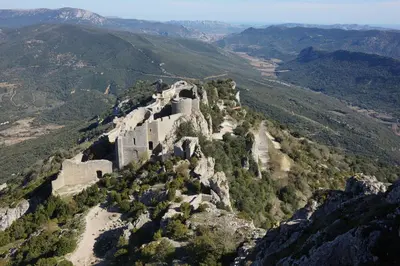 a castle on the side of a mountain at Chateau de Camurac in Camurac