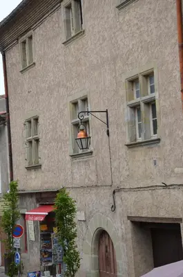 a building with a street light on the side of it at Pelletier du Claux in Carcassonne