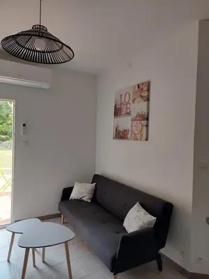 a living room with a couch and a table at Château Haut Gléon in Villesèque-des-Corbières