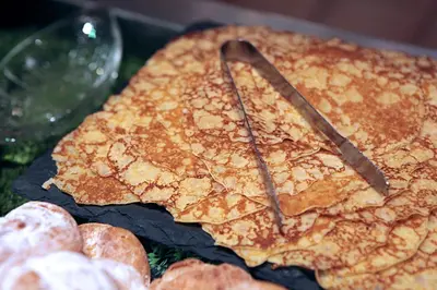 a cake sitting on top of a table with glasses at Logis hôtel restaurant Auberge de l'Espinouse in Fraisse-sur-Agout