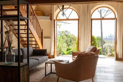 a living room with a couch and a table at Domaine de la Bade in Raissac-sur-Lampy