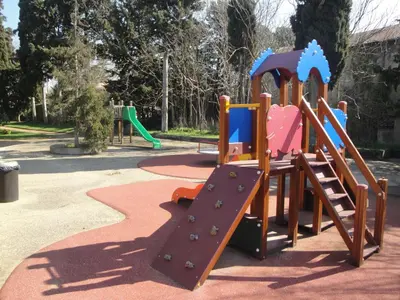 a playground with a slide in a park at Hôtel Restaurant du Lauragais LOGIS DE FRANCE in Villefranche-de-Lauragais
