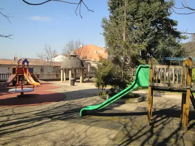 a playground with a slide at Hôtel Restaurant du Lauragais LOGIS DE FRANCE in Villefranche-de-Lauragais