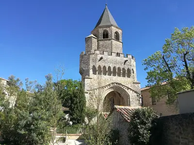 an old tower with a steeple on top of a building at Gîte Maison de l'Abbé in Sorèze