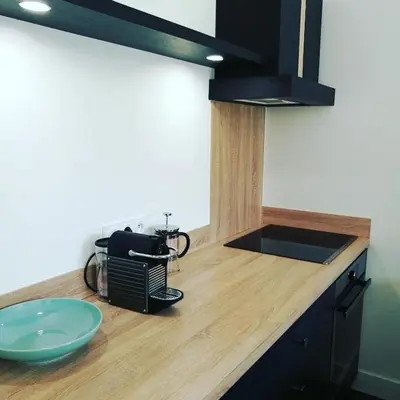 a kitchen with a counter with a blue bowl on it at Gîte Maison de l'Abbé in Sorèze