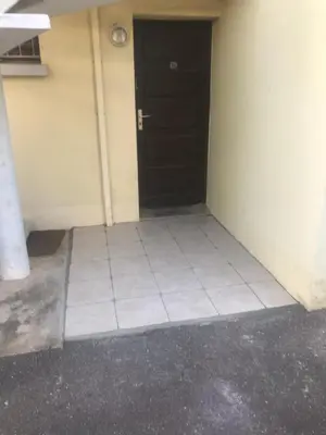 an empty room with a door and a tile floor at 480 Rue de la Hune in Gruissan