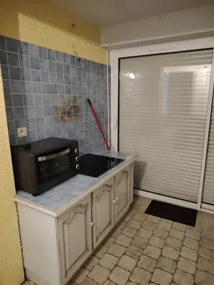 a kitchen with a microwave on top of a counter at 480 Rue de la Hune in Gruissan
