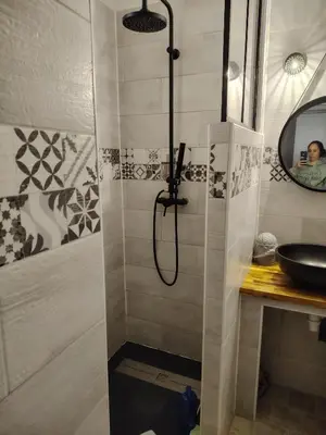 a bathroom with a shower and a sink at 480 Rue de la Hune in Gruissan