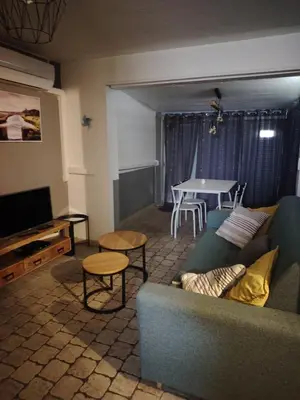 a living room with a couch and a table at 480 Rue de la Hune in Gruissan