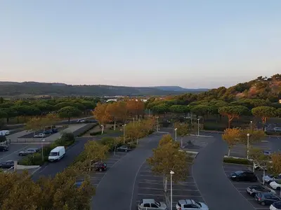 an aerial view of a parking lot with cars at logis 194 in Gruissan