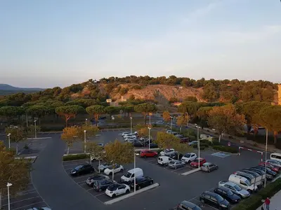 an aerial view of a parking lot with cars at logis 194 in Gruissan