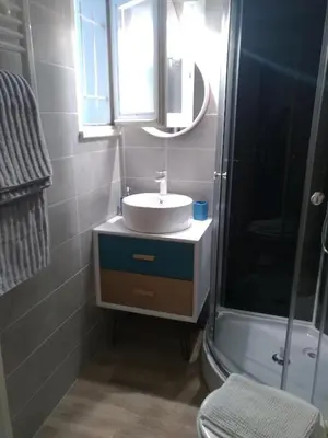 a bathroom with a sink and a shower at logis 149 in Gruissan