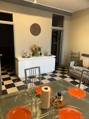 a kitchen and living room with a table and chairs at maison des corbieres in Conilhac-Corbières