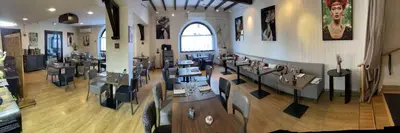 an overhead view of a restaurant with tables and chairs at Logis Hôtel de France & Restaurant Pamiers in Pamiers
