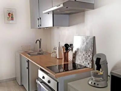 a kitchen with a sink and a counter top at TERRASSE du GET in Revel