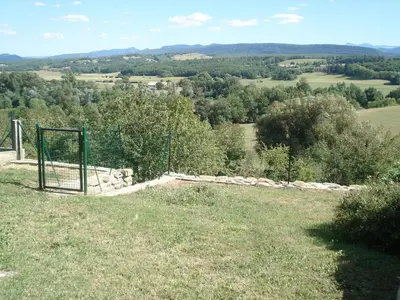 a goal in a field with a fence and trees at Gîte du Tarbésou in Régat