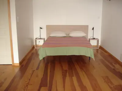 a bedroom with a bed with two pillows on it at Gîte du Tarbésou in Régat