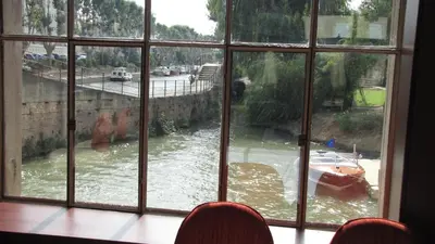 a view of a river from a window at Ile du Gua Suites in Narbonne