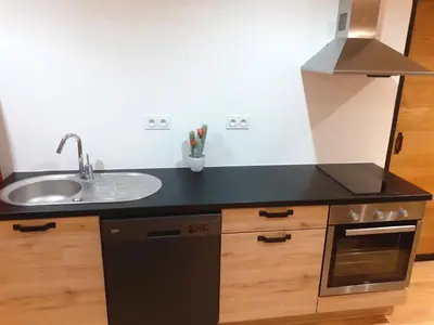 a small kitchen with a sink and a stove at 