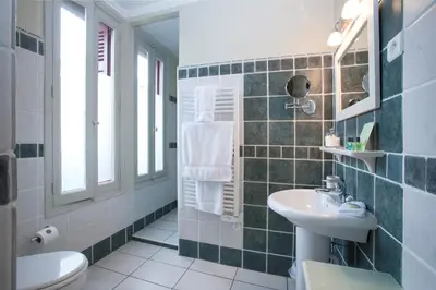 a bathroom with a sink and a toilet at La Villa de Mazamet in Mazamet