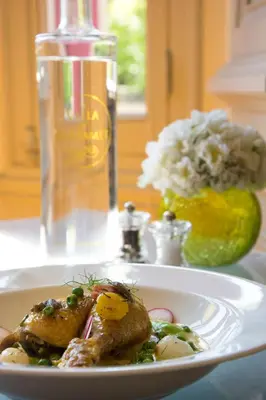 a white plate of food on a table at La Villa de Mazamet in Mazamet