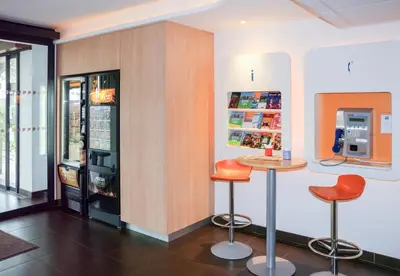 a bathroom with a sink and a mirror at ibis budget Castelnaudary - A61 in Castelnaudary