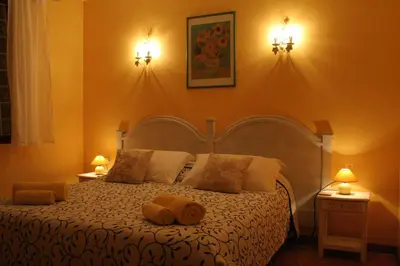 a bedroom with a bed with two towels on it at Les Eaux Tranquilles in Belvianes-et-Cavirac