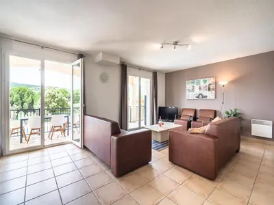 a living room with a couch and a table at Wine Country Family Villa in Félines-Minervois