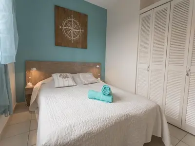 a bedroom with a bed with a towel on it at Modern villa with private pool in Pouzols-Minervois
