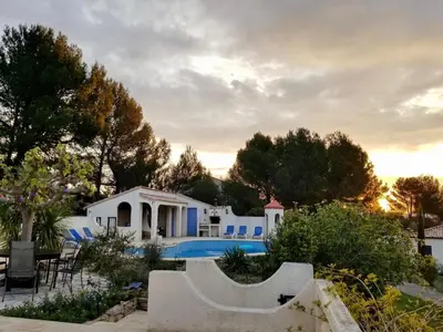 a villa with a swimming pool and a house at Modern villa with private pool in Pouzols-Minervois