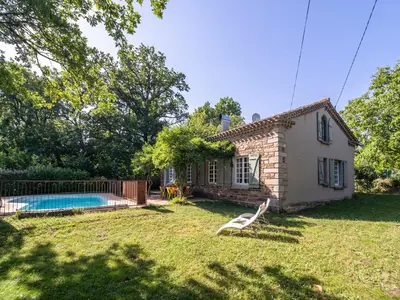 a small house with a pool in the yard at Stone House St Denis with Pool & Views in Saint-Denis