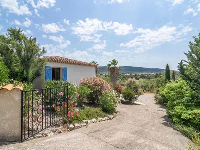 a house with a gate in a garden at Modern Villa with Heated Pool in Beaufort
