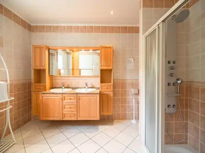 a bathroom with two sinks and a shower at Hillside Retreat in Roquebrun in Roquebrun