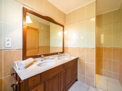 a bathroom with a sink and a mirror at Villa in Limoux with Private Pool & Mountain Views in Limoux