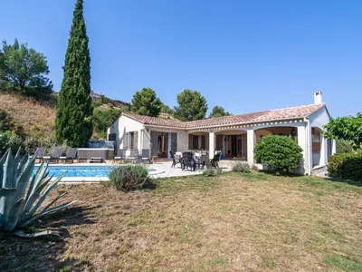 a villa with a swimming pool and a house at Relaxing Villa Near Lake & Beaches in Beaufort
