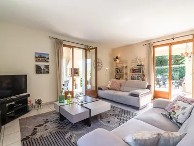 a living room with two couches and a tv at Relaxing Villa Near Lake & Beaches in Beaufort