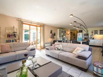 a living room with two couches and a table at Relaxing Villa Near Lake & Beaches in Beaufort