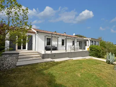 a white house with a lawn in front of it at Villa in Malves near Carcassonne Pool in Malves-en-Minervois