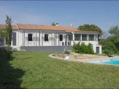 a house with a swimming pool in front of it at Villa in Malves near Carcassonne Pool in Malves-en-Minervois