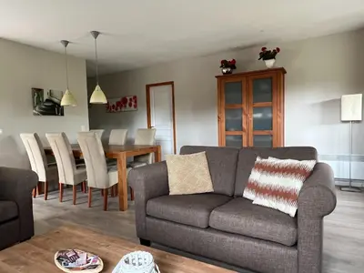 a living room with a couch and a table at Villa near Carcassonne with Heated Pool in Félines-Minervois