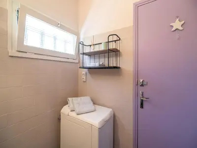 a small bathroom with a toilet and a window at Villa in Pouzols with Private Pool in Pouzols-Minervois