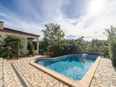 a swimming pool in the backyard of a house at Spa Oasis Near Canal du Midi in Félines-Minervois