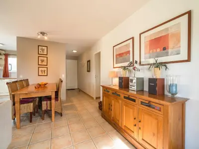 a kitchen and dining room with a table and a dining room at Spa Oasis Near Canal du Midi in Félines-Minervois