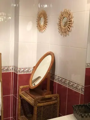 a bathroom with a mirror on the wall at Côte de la Cité in Carcassonne