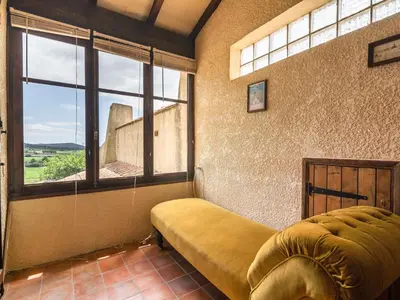 a room with a bed and a large window at Villa in Beaufort with Pool & Views in Beaufort